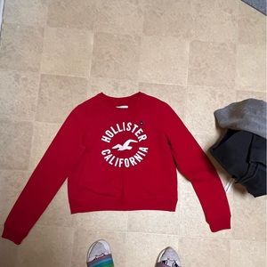 Hollister sweatshirt size medium.  Red with Hollister logo. Brand new never worn